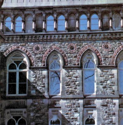 color photo of east wall of West Block of Nepean sandstone with Wallace and red sandstone trim