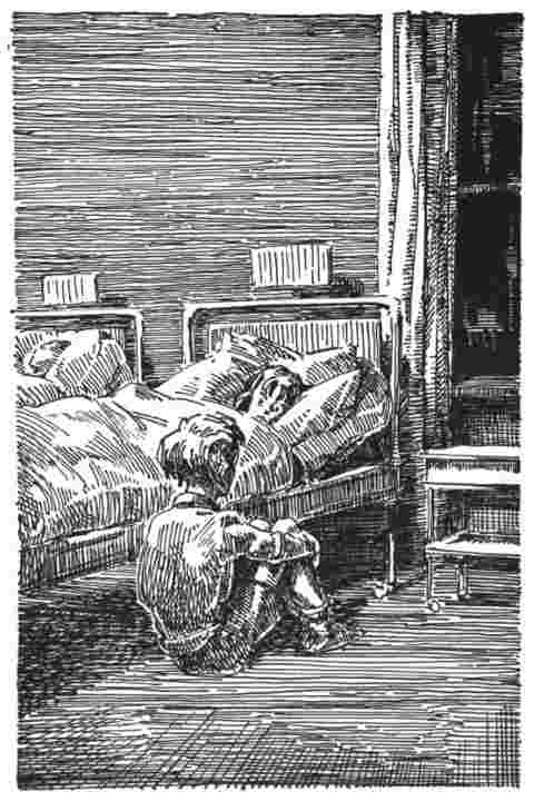 Boy comforts injured friend in bed