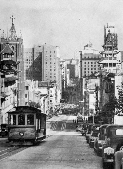 looking down California St hill with cable car coming uphill