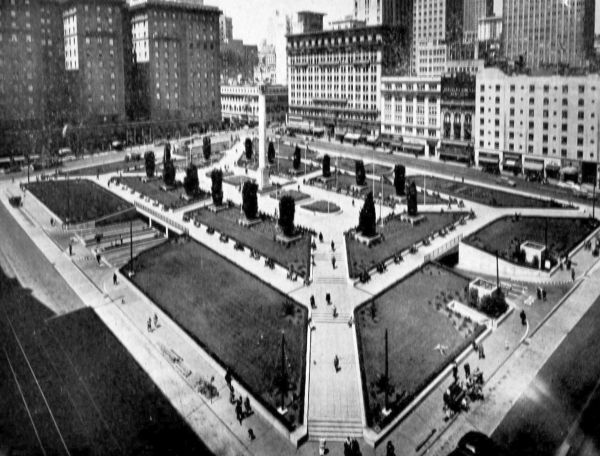 looking down on Union Square park with underground parking and shopping stores and hotels surrounding park
