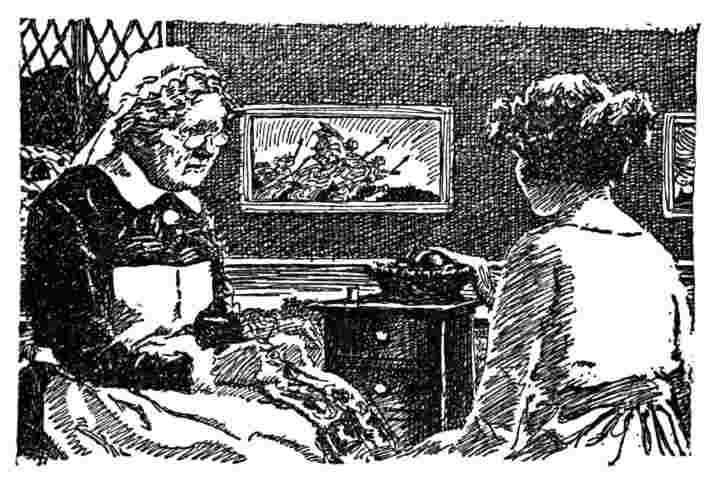 Two women talk while sewing