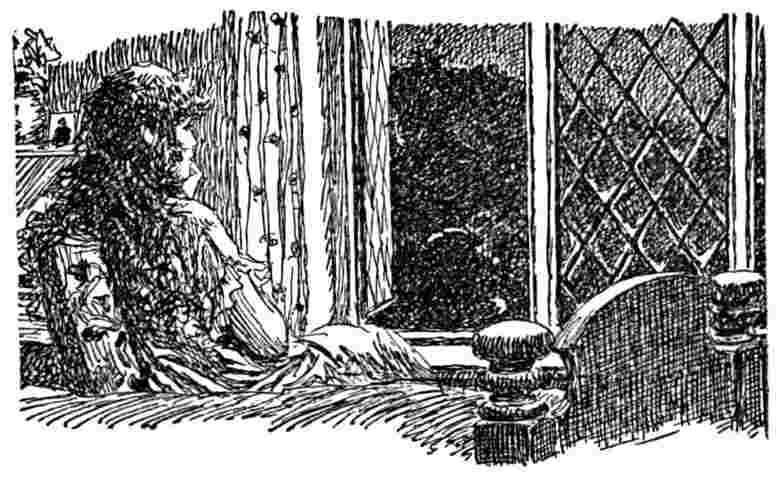 Woman looks out a window
