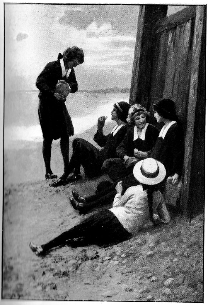 Several girls dressed in school clothing eating lunch sitting on the ground