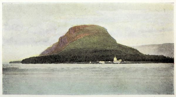 dome-shaped mountain surrounded by water with lighthouse at base