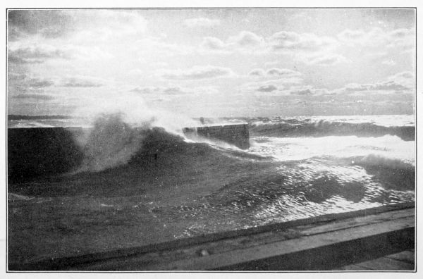 waves pounding harbour walls