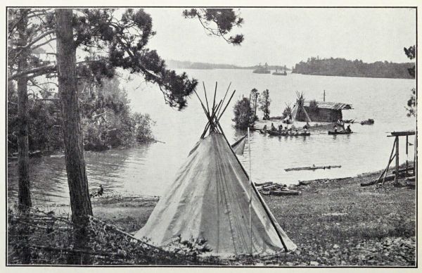 teepee in foreground and Indians in canoes on the bay