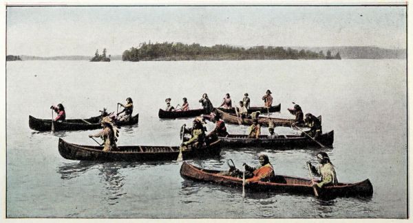 6 canoes with Ojibway Indians