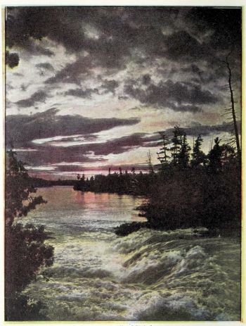 small waterfalls pouring into channel