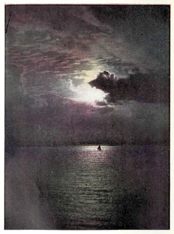 moonlight shining on sailboat in bay