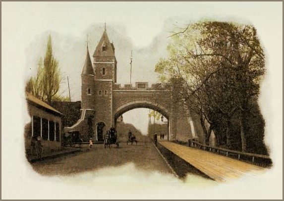 Image of a fortified stone gate with twin towers on the left, rising over an arched roadway with a wooded walkway on the right. Horse-drawn carriages and pedestrians can be seen on the road and the walkway.