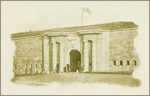 Illustration shows the entrance to a stone fort with a large arched doorway, flanking columns, and a flag flying above its grassy roof. There are three uniformed people standing at the arched entrance.