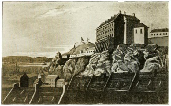 Illustration showing a large fortress-like building perched on a rocky hill, overlooking smaller town structures below.